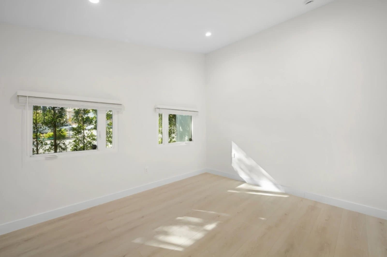 Finished ADU room with garden-facing windows