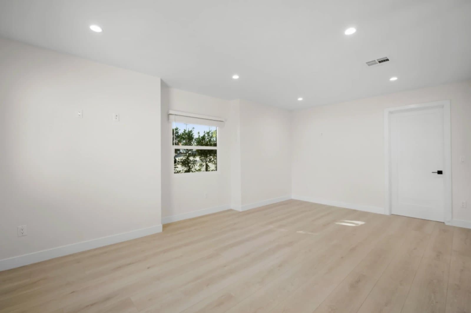 Light-filled ADU room looking out on greenery