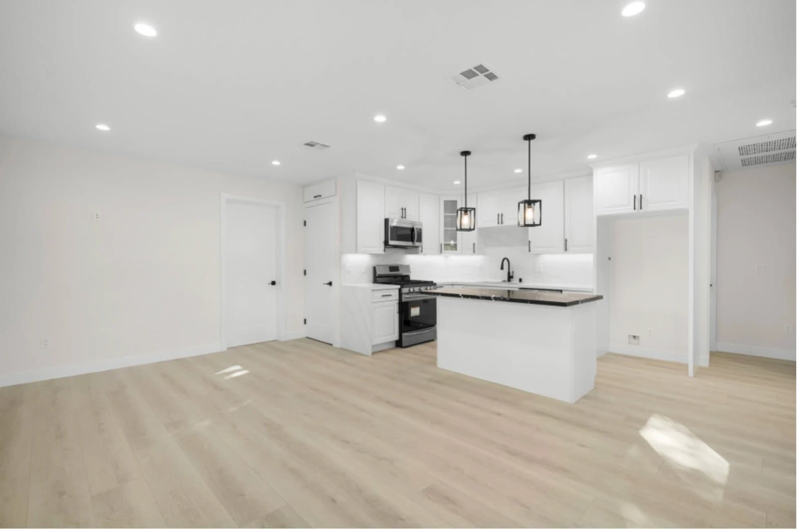 Open-plan living and kitchen area in a completed ADU